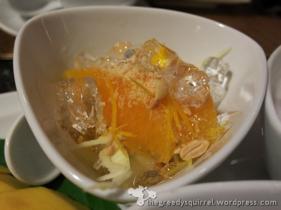 Som Chun Fresh Orange sections Topped with Lychees, Shredded Mango, Sliced Ginger, Toasted Coconut and Roasted Peanuts served in a Ginger Syrup